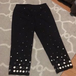 Black and white pants brand is R-Q-T